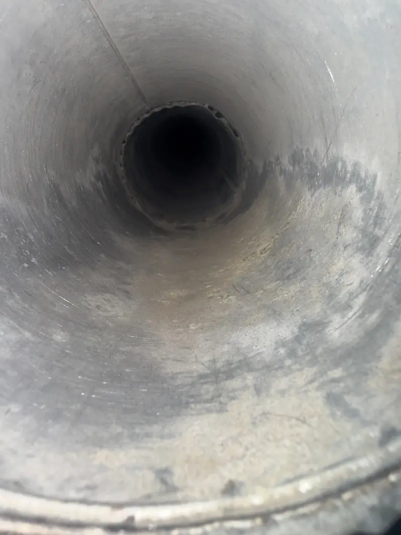 The same dryer vent duct after cleaning, clear metal interior